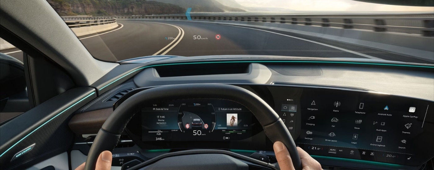 Person steering a  2025 Audi Q6 e-tron